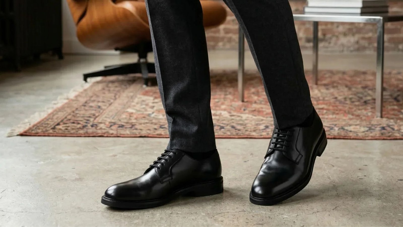 A person wearing black shoes showing a formal and attractive style