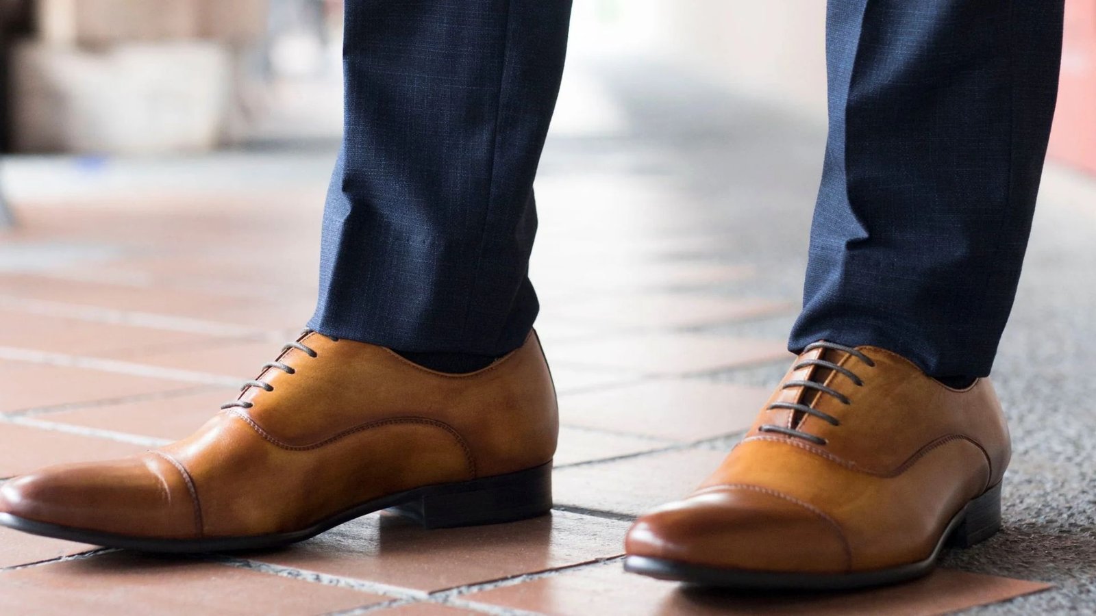 A person wearing brown shoes showing a bold look