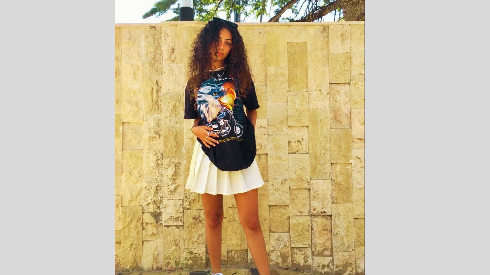 Tennis skort styled with a sweatshirt and sneaker